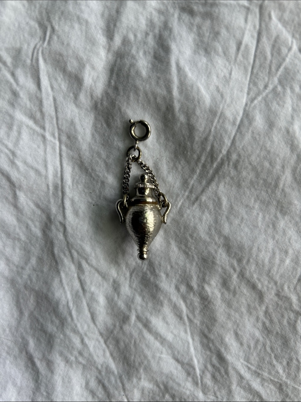 Amphora perfume dabber charm.